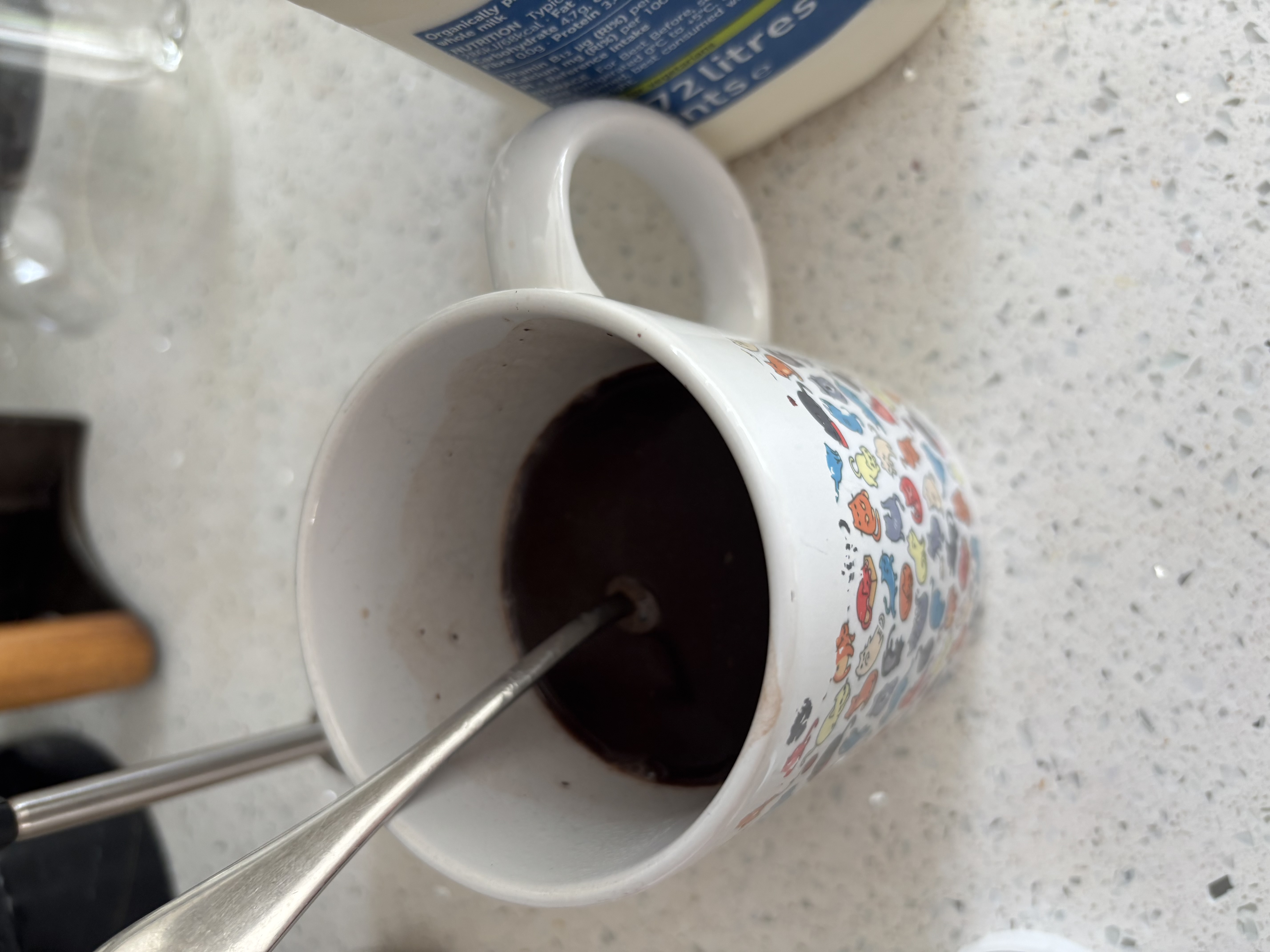 Mug with hot water being stirred